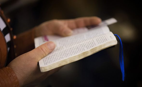A parishioner reads her Bible at Chongwenmen Church in Beijing, China. Chinese Bible production, which was halted during the Cultural Revolution, began again in the 1980s with a prototype taken from old Bibles that had not been confiscated by the Red Guards.
